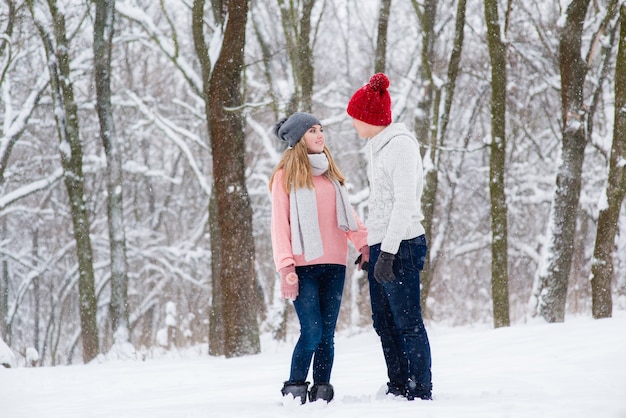 Young couple in winter forest