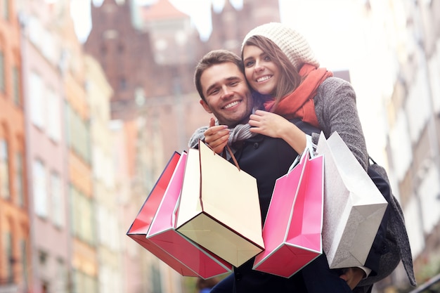 young couple with shopping bags