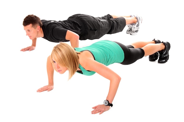 a young couple working out over white