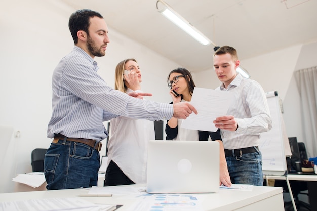 Young coworkers discussing a project