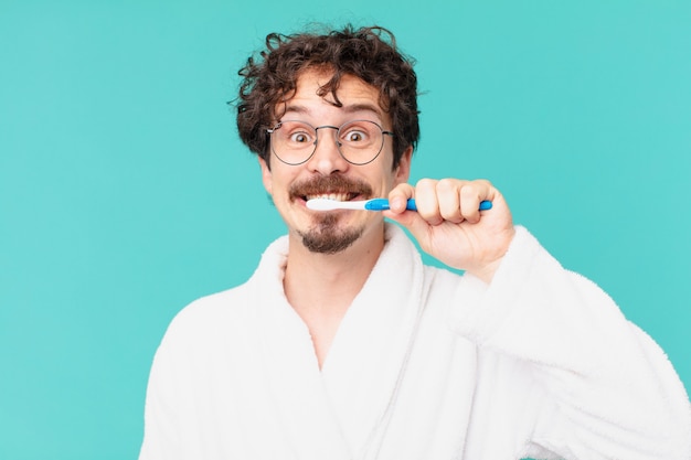 Young crazy man with a teethbrush