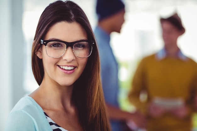 Young creative worker smiling at camera