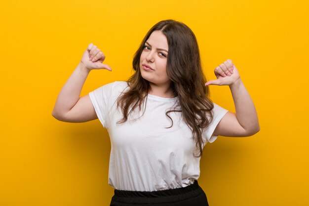 Young curvy plus size woman feels proud and self confident, example to follow.