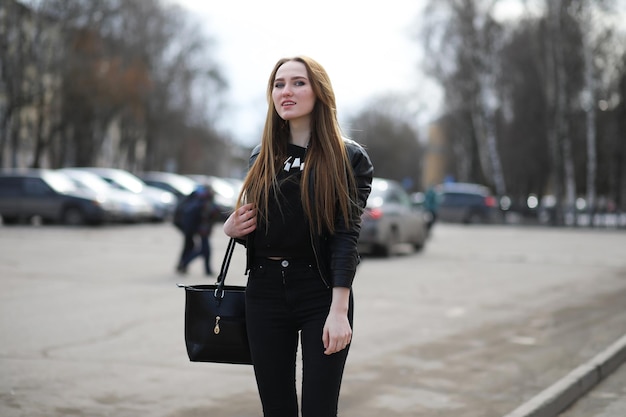 Young cute girl on a walk in the city