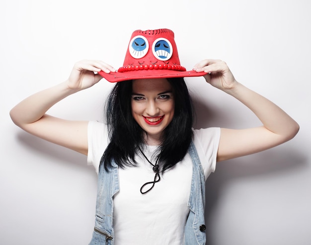 Young cute smiling brunette girl over white background