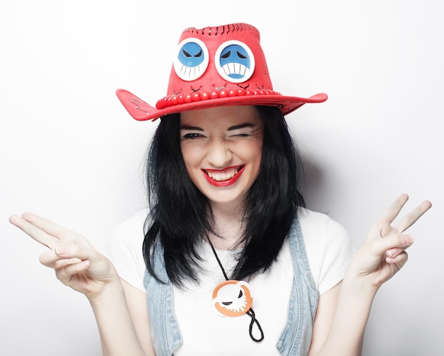 Young cute smiling brunette girl over white background