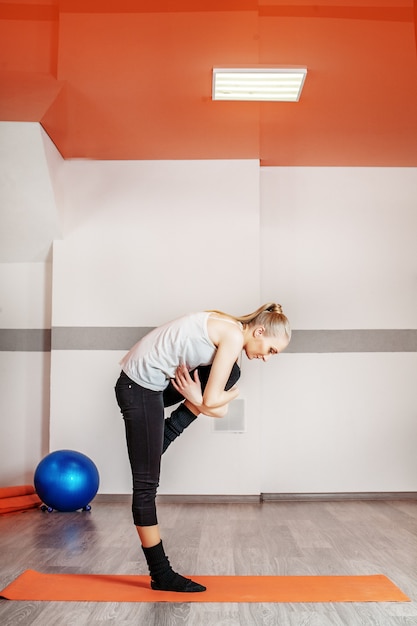 Young dancer teaches dance in the gym.