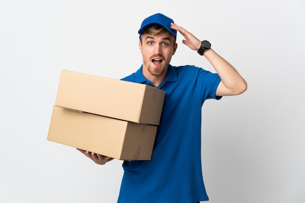 Young delivery blonde man isolated with surprise expression