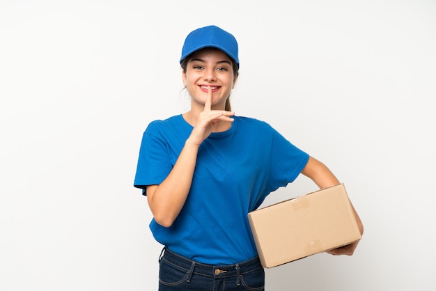 Young delivery girl over isolated white wall doing silence gesture