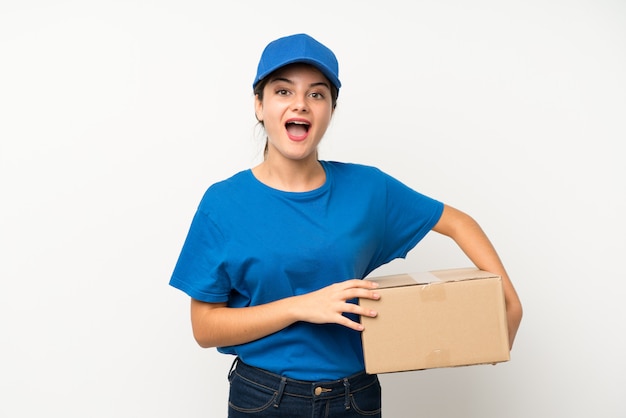 Young delivery girl over isolated white with surprise facial expression