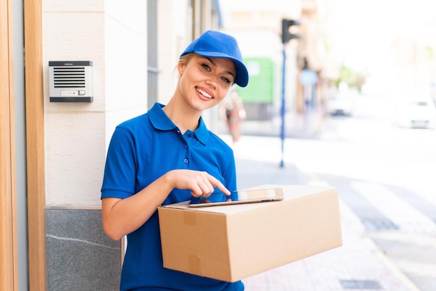 Young delivery woman at outdoors