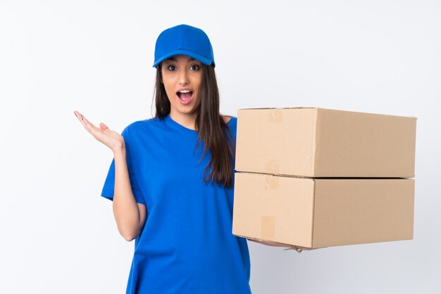 Young delivery woman with surprise facial expression