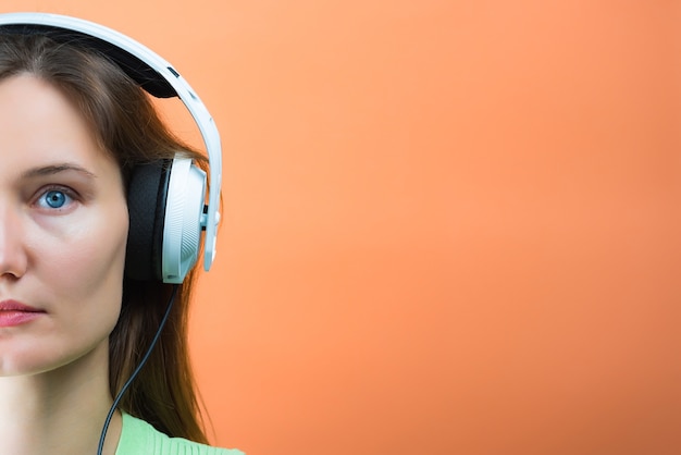 Young dj woman with white headphones, Musical hifi headphones.