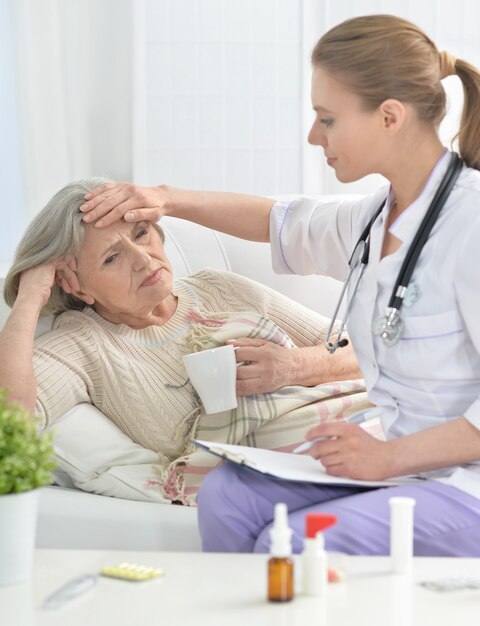 Young doctor and her senior senior patient