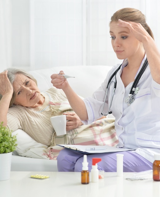 Young doctor and her senior senior patient