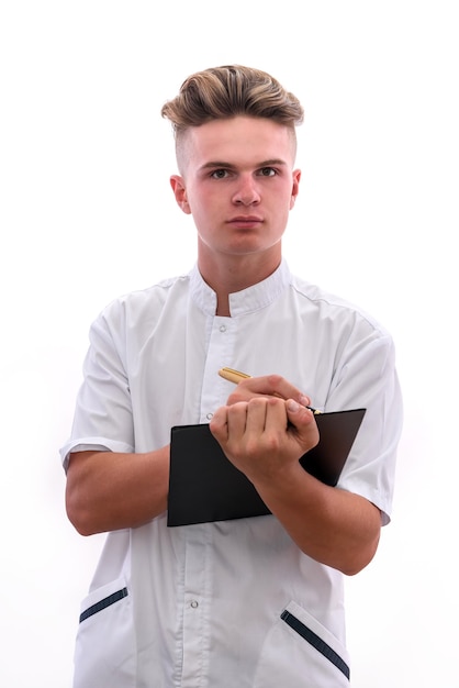 Young doctor with clipboard and pen isolated on white background