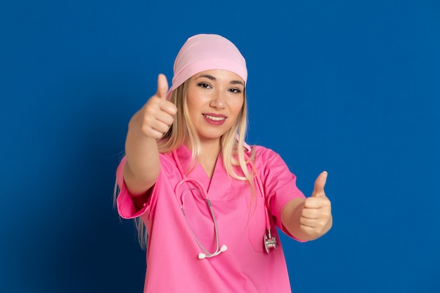 Young doctor with a pink uniform and a scarf