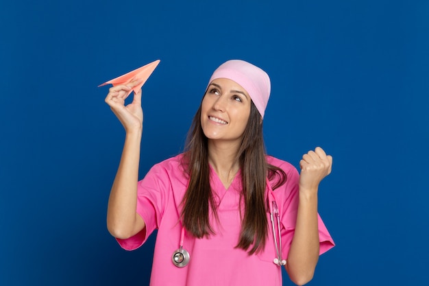 Young doctor with a pink uniform