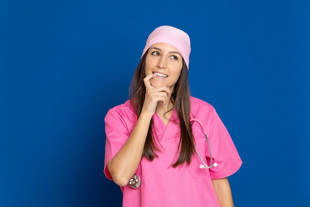 Young doctor with a pink uniform