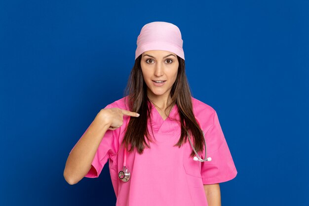 Young doctor with a pink uniform