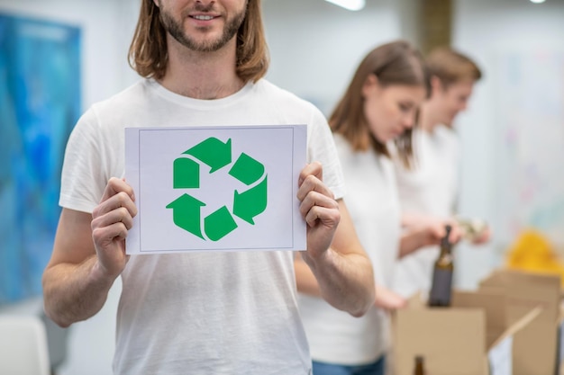 Young ecologists working in a recycling center