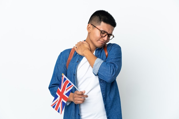 Young Ecuadorian woman holding an United Kingdom flag isolated on white background suffering from pain in shoulder for having made an effort