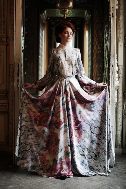 Young elegance woman with flying dress in palace room