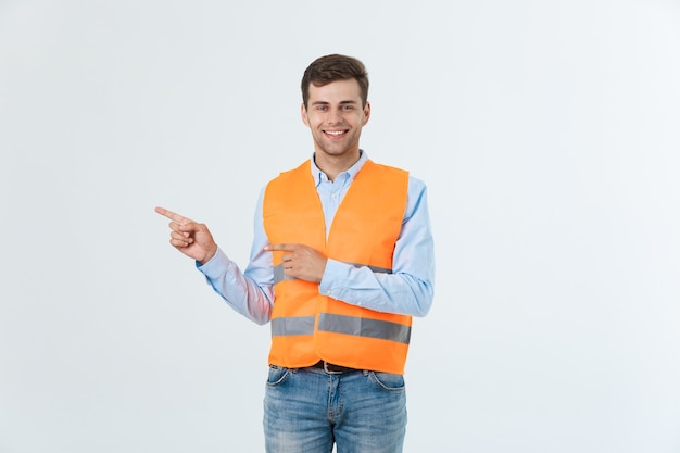 Young engineer smiling isolated on white background.