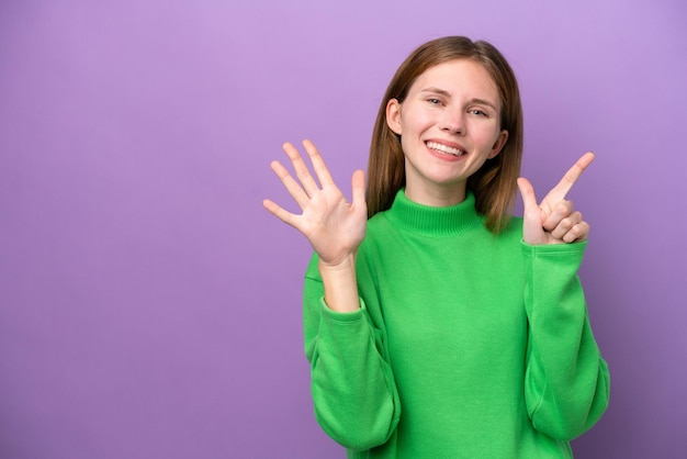 Young English woman isolated on purple background counting seven with fingers