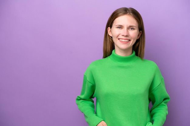 Young English woman isolated on purple background laughing