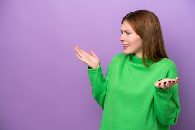 Young English woman isolated on purple background with surprise expression while looking side