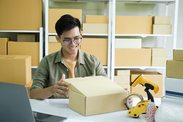 Young entrepreneur checking order preparing for delivery