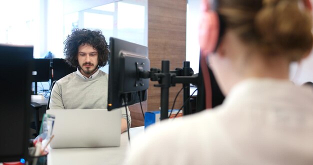 Young Entrepreneur Freelancer Working Using A Laptop In Coworking space