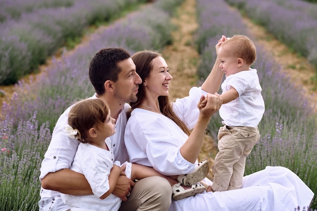 The young family came to the lavender field to relax from the city noise.