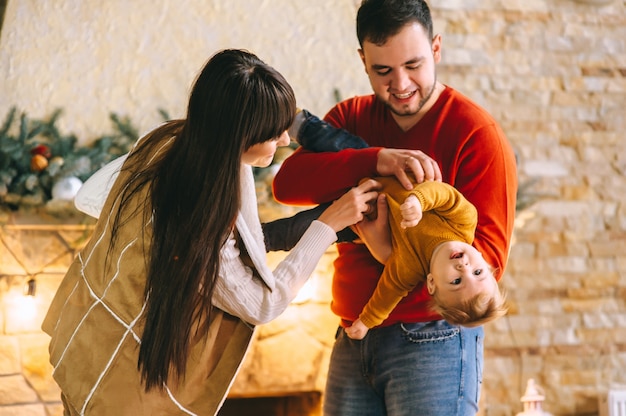 Young family in Christmas interior