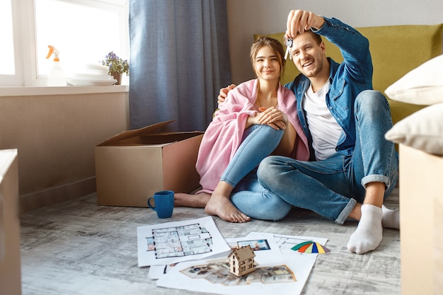 Young family couple bought their first small apartment