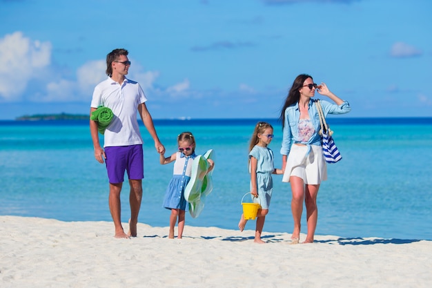 Young family of four on beach vacation