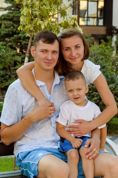 Young family - mother, father and son in a new residential complex.