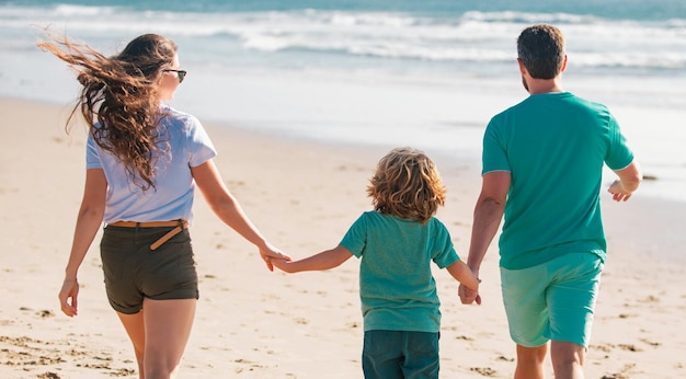 Young family walking on beach young happy family having fun together at the sea beach