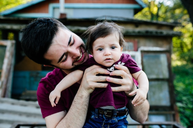 Young family with child posing on abandoned building