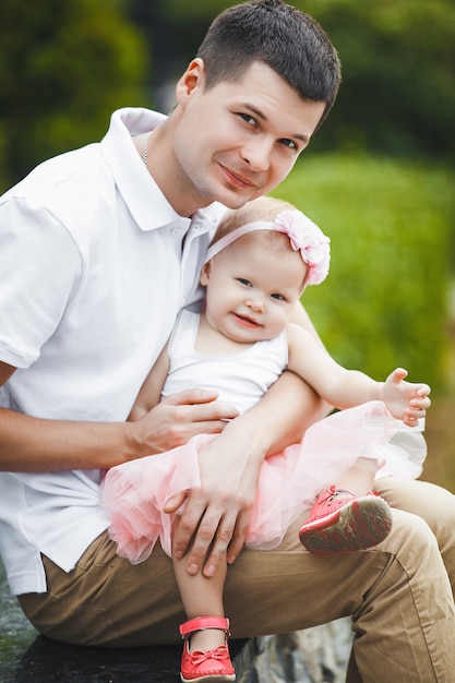 Young father with his little child outdoors