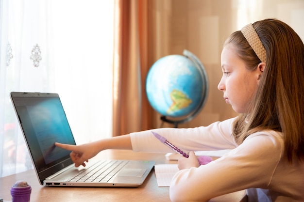 Young female distance teacher having video conference call with pupil using webcam Online education and elearning concept Home quarantine distance learning and working from home