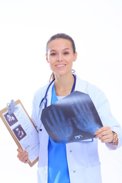 Young female doctor looking at the xray picture isolated on white background Woman doctor