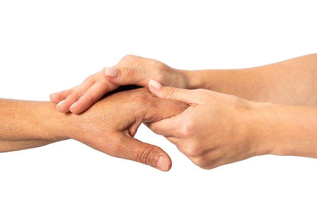 Young female hands hold the hand of elderly woman The concept of family relationships togetherness