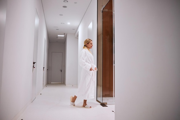 Young female patient standing in the doorway