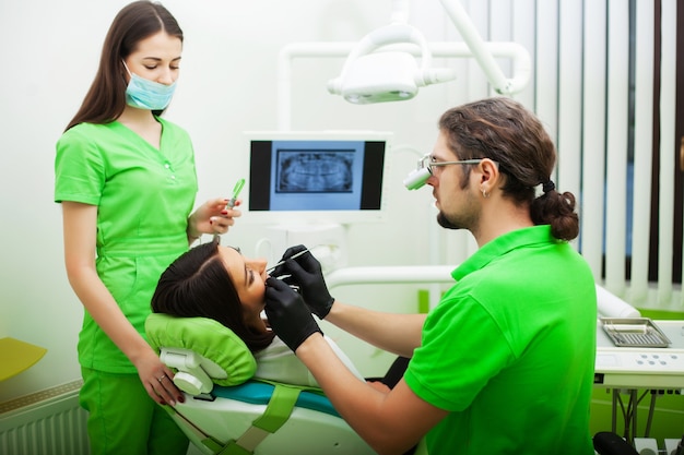 Young female patient visiting dentist office