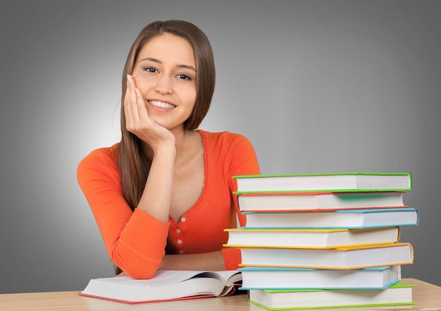 Young female student  on background