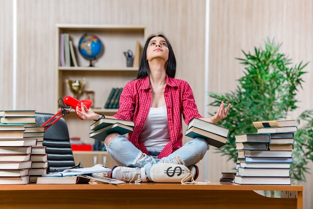 Young female student preparing for college school exams