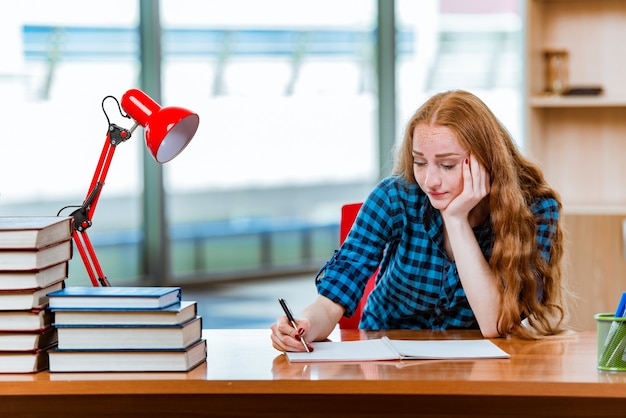 Young female student preparing for exams