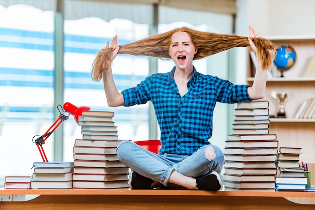 Young female student preparing for exams